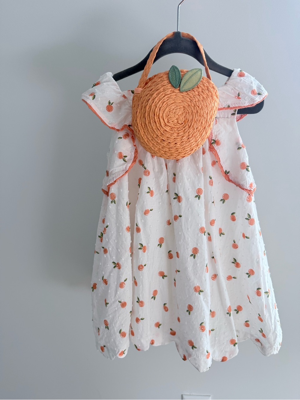Rachel Zoe White Dress with Peach Print and Orange Straw Bag